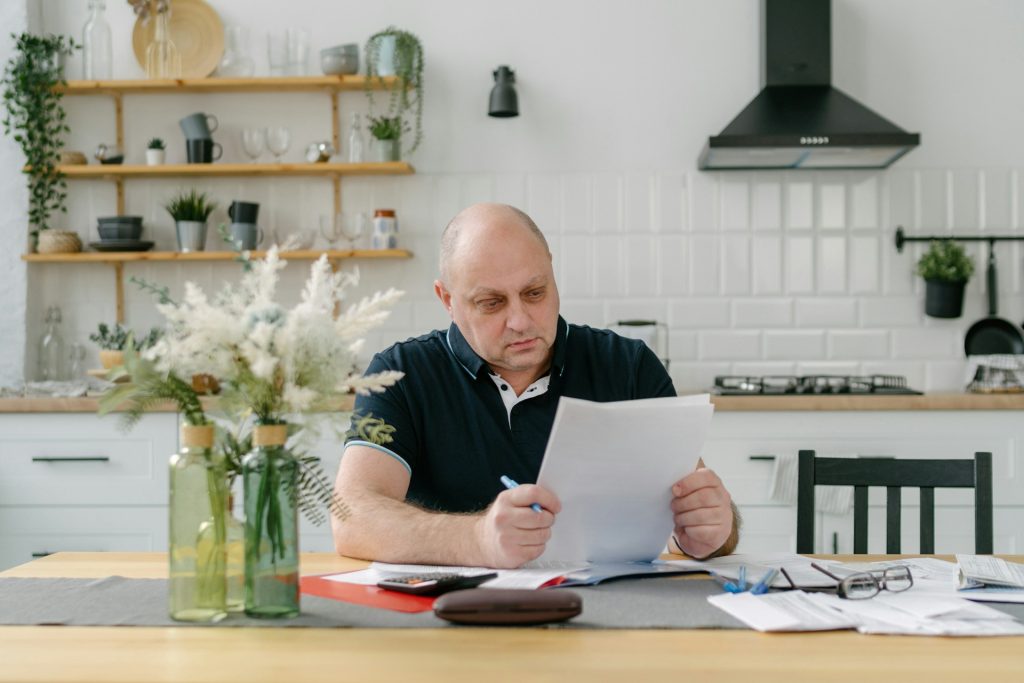 A Section 8 real estate investor analyzing a rental property profit and loss statement for an affordable housing deal.